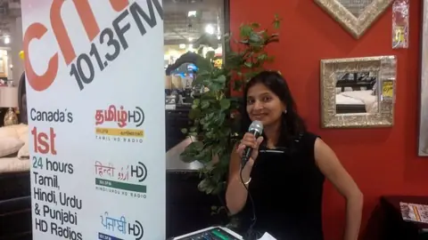 Swati broadcasting live at a CMR 101.3 FM booth