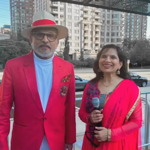 RJ Swati holding a microphone at Canada Diwali RazzMatazz 2025